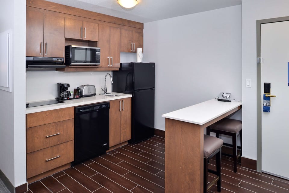 Exclusive Room, 1 King Bed, Kitchen (Living Area) | Living area | 50-inch Smart TV with cable channels, TV, streaming services