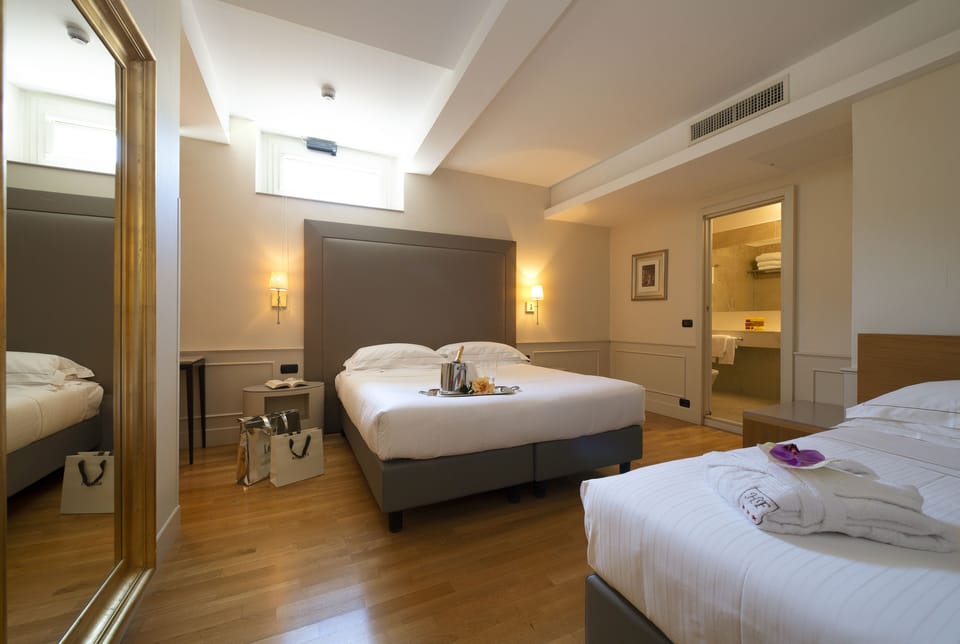 Classic Triple Room | Down comforters, minibar, in-room safe, desk