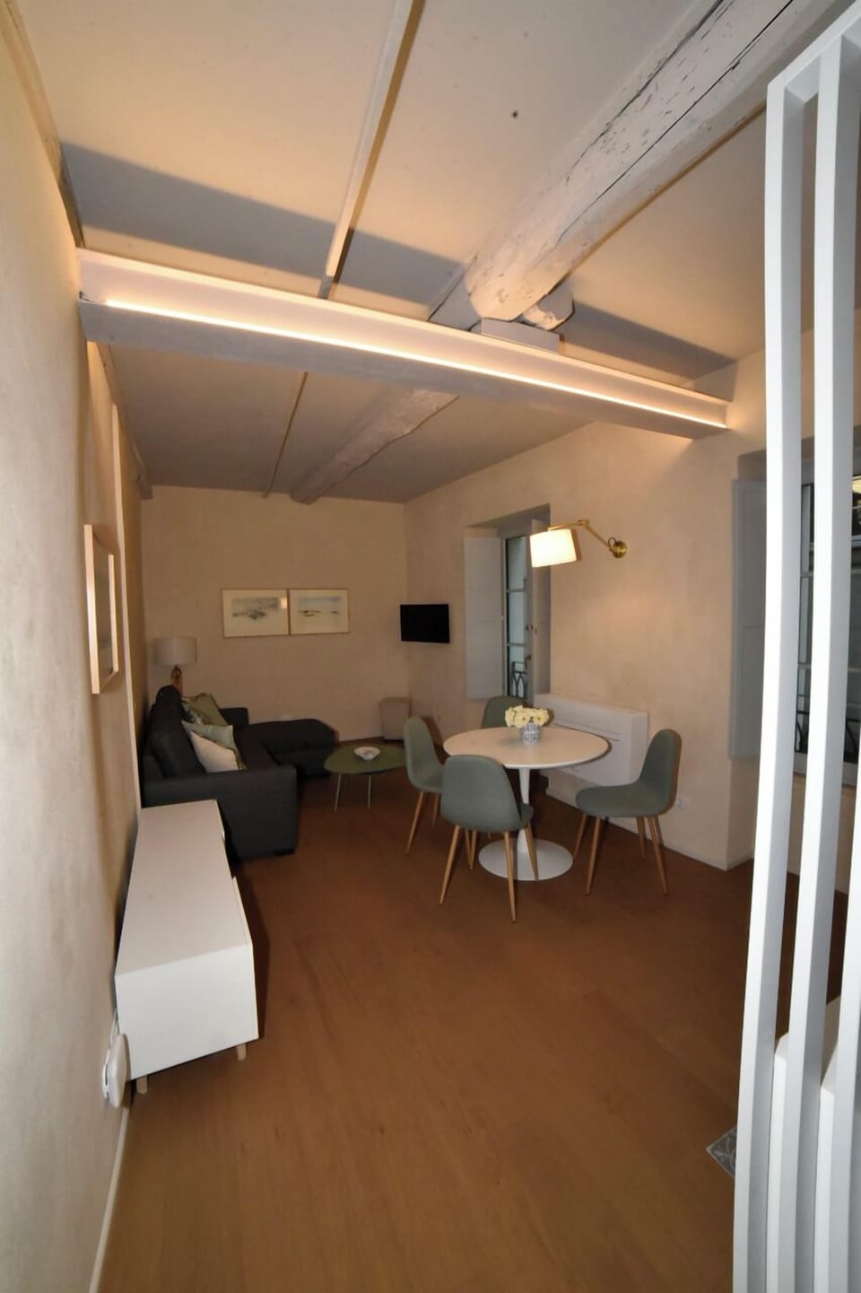 Deluxe Condo | Living area | 32-inch Smart TV with digital channels, TV, streaming services