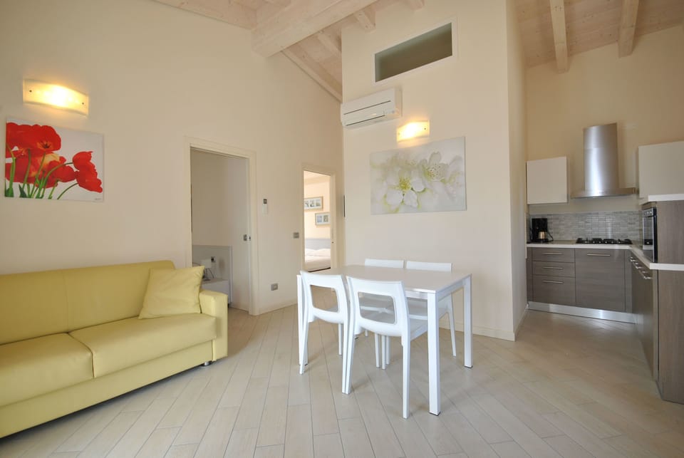 Standard Apartment, Lake View | Living area | 22-inch flat-screen TV with satellite channels, TV