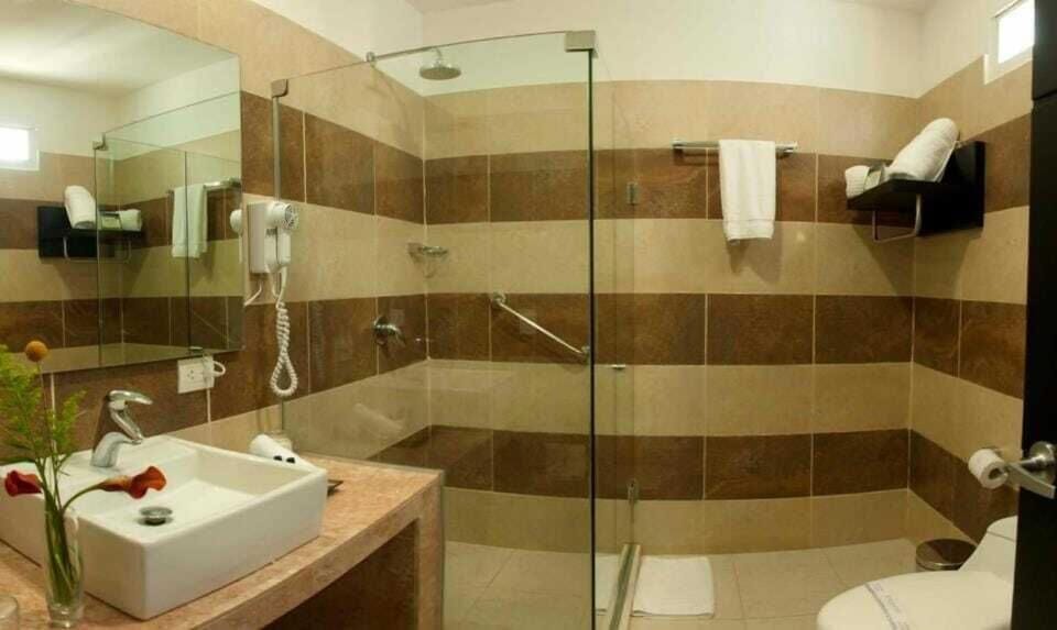 Shower, free toiletries, hair dryer, slippers