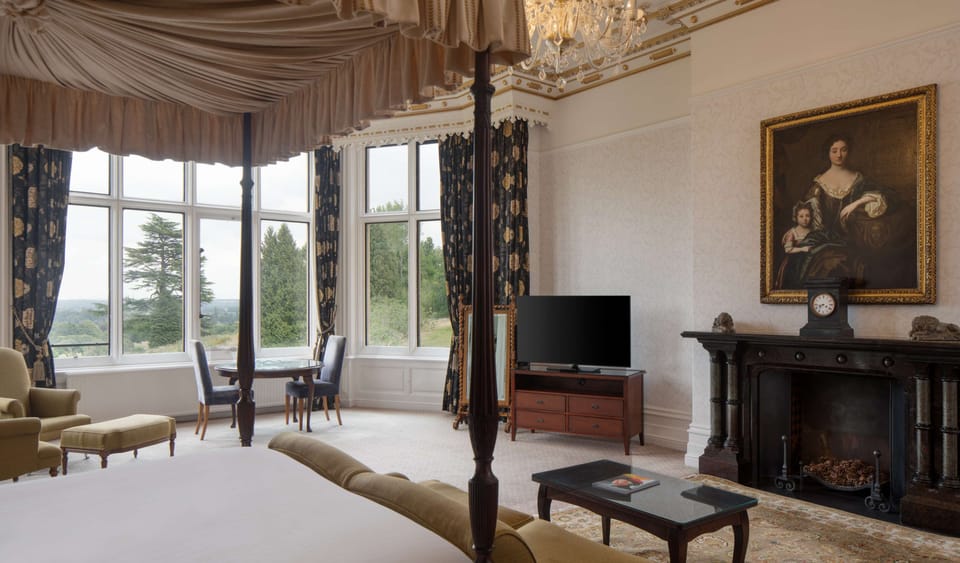 Premium bedding, desk, laptop workspace, iron/ironing board