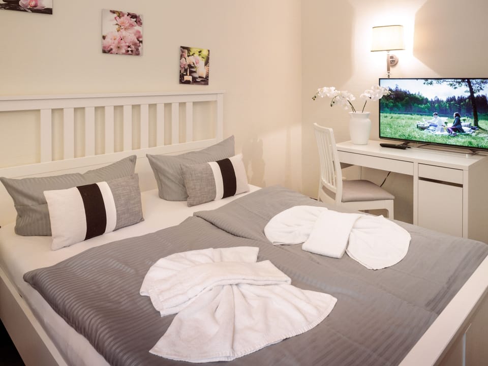 Premium bedding, pillowtop beds, desk, blackout drapes