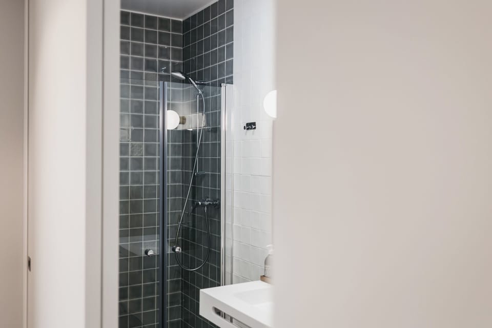 Rainfall showerhead, hair dryer, slippers, towels