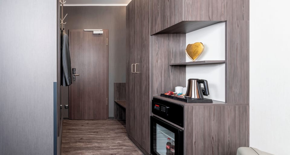 Triple Room | Minibar, in-room safe, desk, rollaway beds