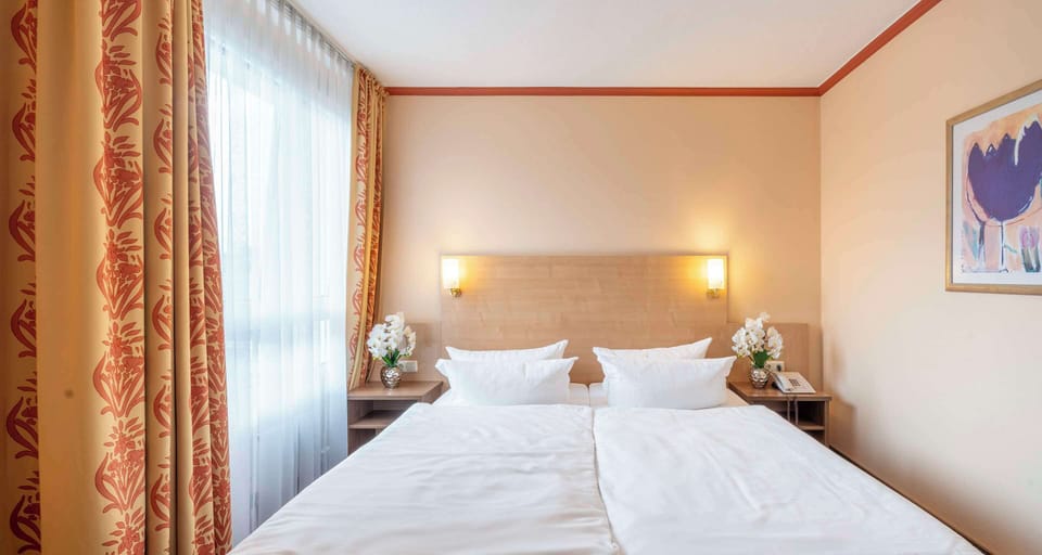 Hypo-allergenic bedding, in-room safe, desk, laptop workspace