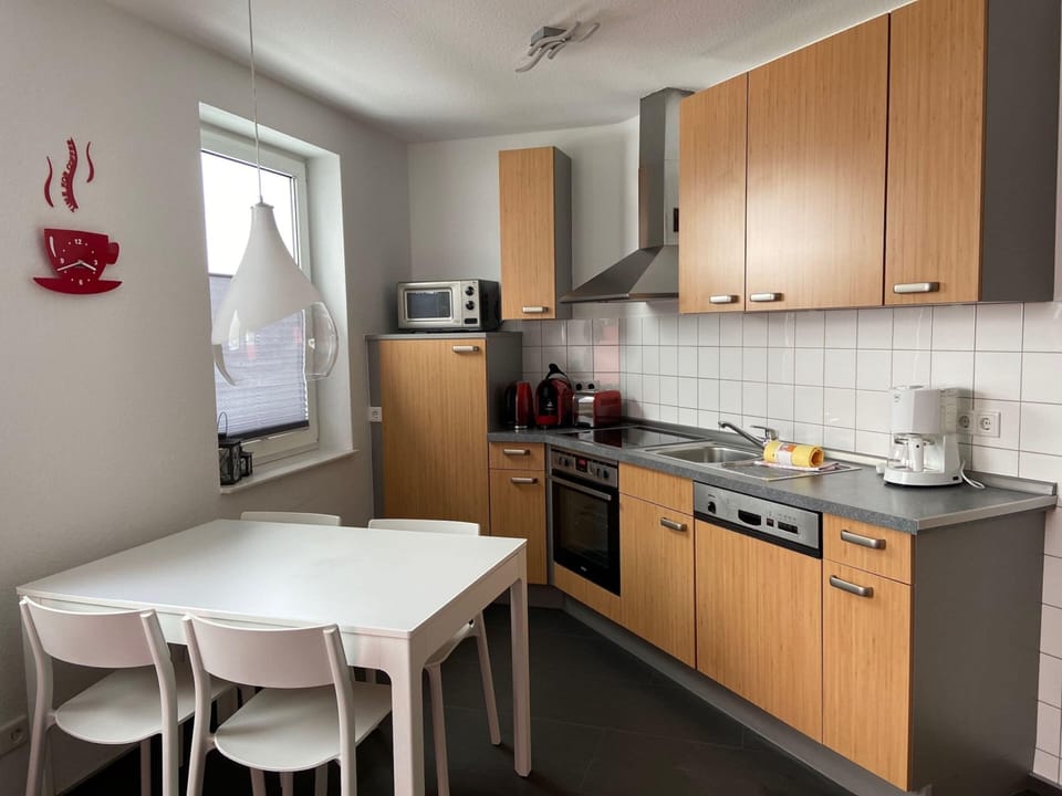 Apartment | Private kitchen | Stovetop, highchair