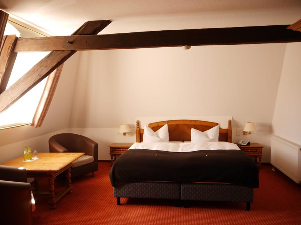 Desk, iron/ironing board, bed sheets