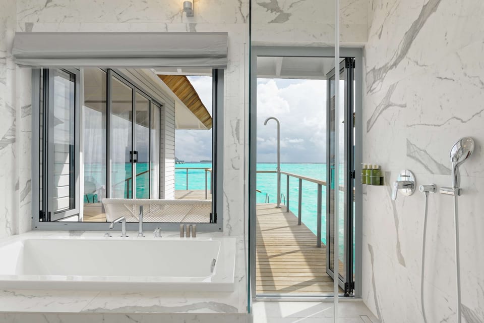 Separate tub and shower, rainfall showerhead, free toiletries
