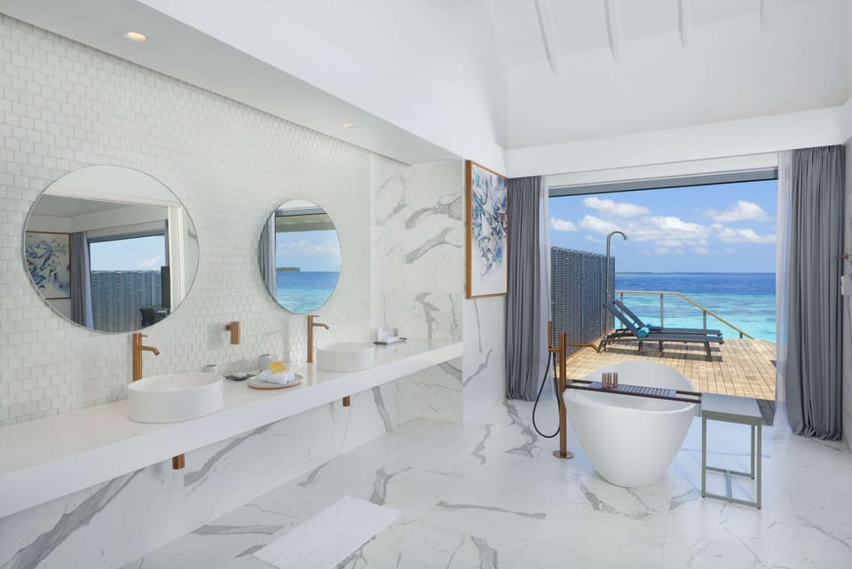 Separate tub and shower, rainfall showerhead, free toiletries
