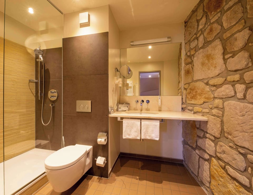 Junior Suite, 1 Double Bed (Cozy Sitting Corner) | Bathroom | Hair dryer, towels
