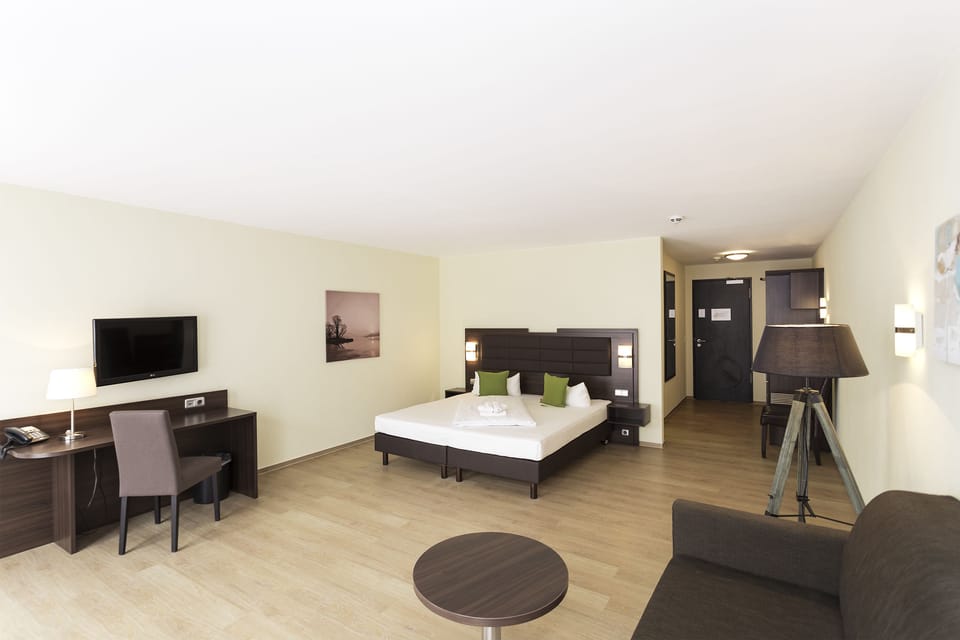 Family Double Room, 1 King Bed with Sofa bed, Non Smoking | Minibar, desk, laptop workspace, blackout drapes