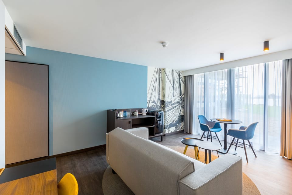Luxury Suite, Lake View | Living area | TV