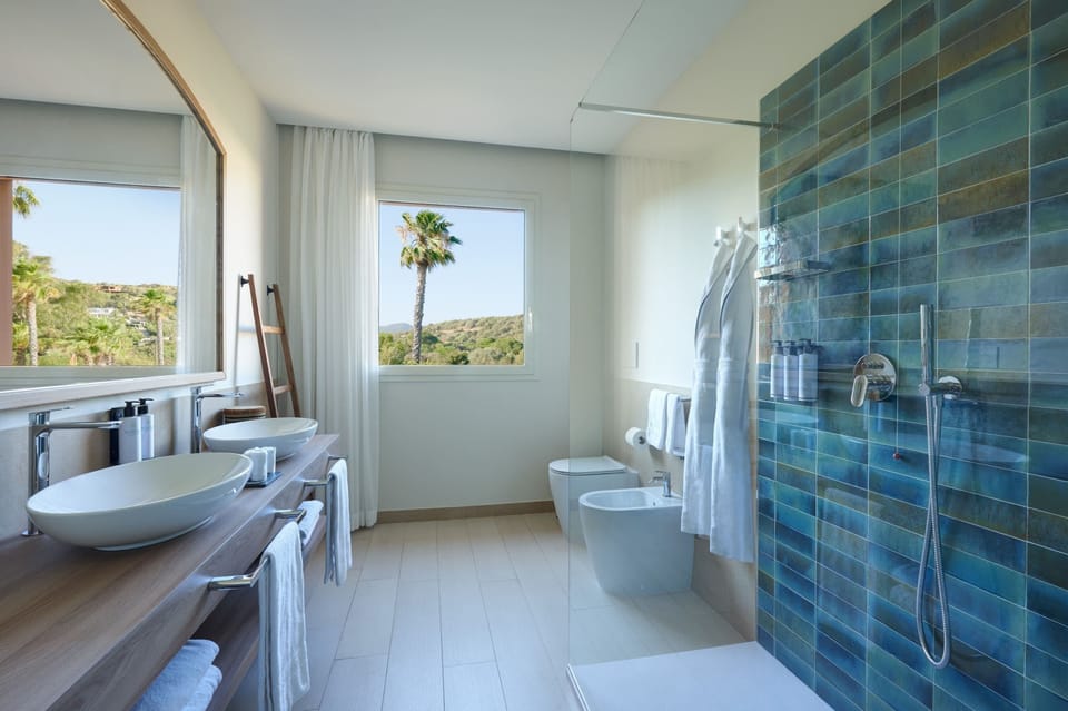Deluxe Triple Room, Garden View | Bathroom | Separate tub and shower, rainfall showerhead, designer toiletries