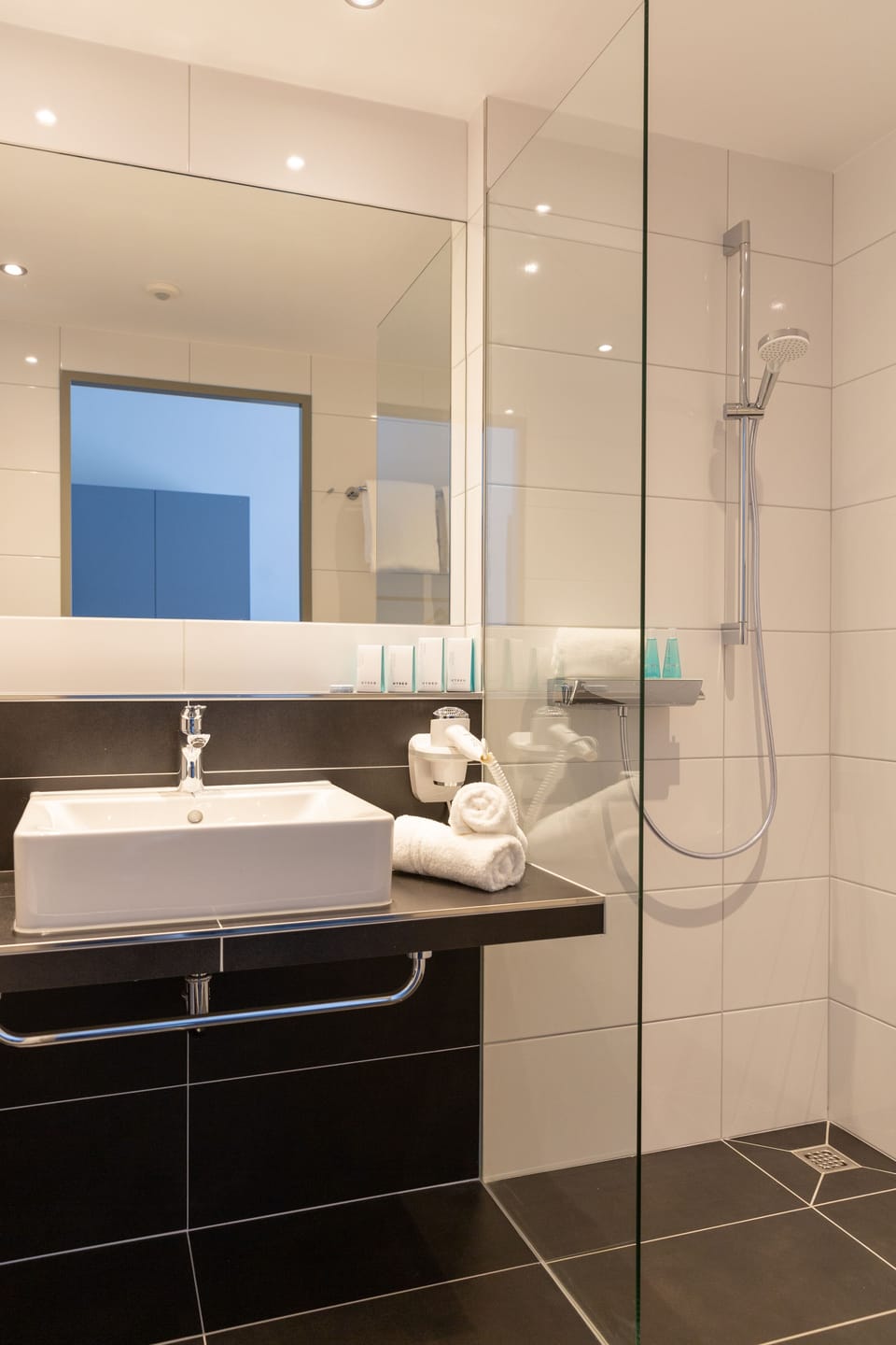 Shower, free toiletries, hair dryer, slippers