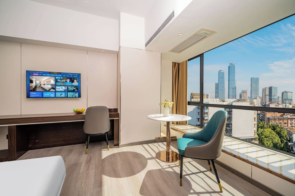 Premium bedding, laptop workspace, blackout drapes, soundproofing