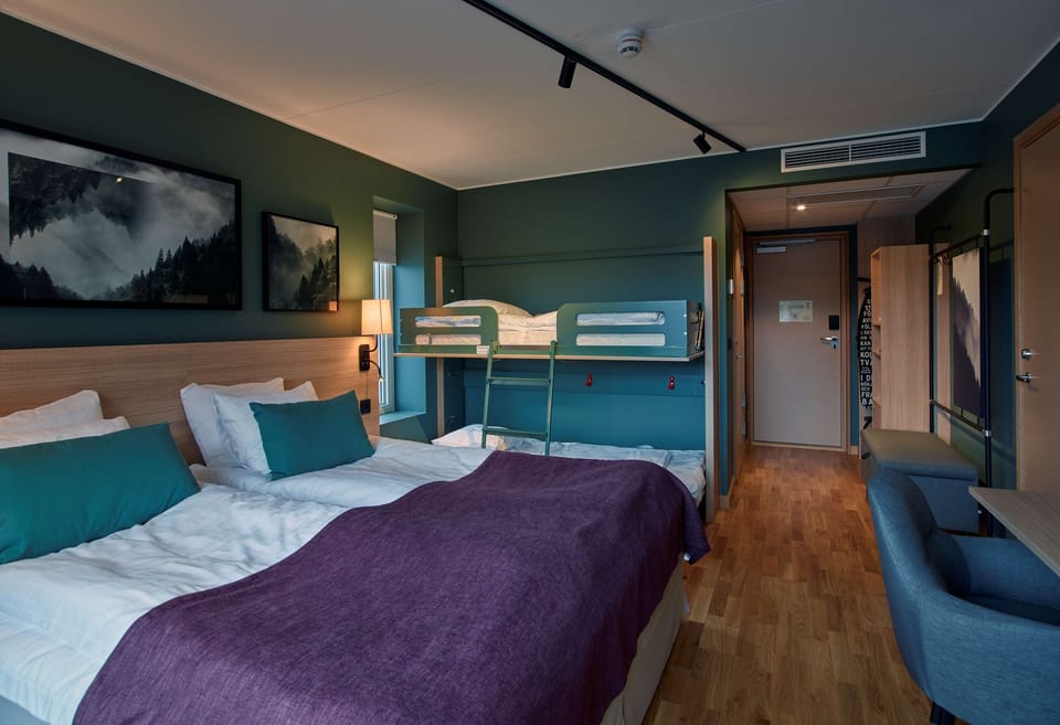 Superior Room (Family Four) | In-room safe, desk, iron/ironing board (on request), WiFi (free)