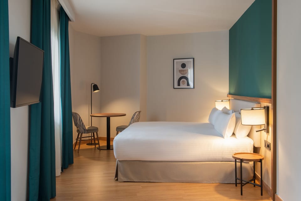 Superior Room | Minibar, in-room safe, desk, iron/ironing board