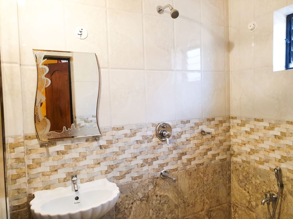 Standard Non-A/C Room | Bathroom | Shower, free toiletries, towels
