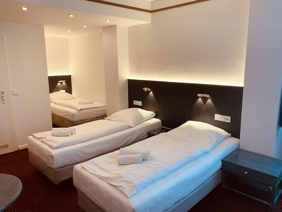 Triple Room | Living area | Flat-screen TV