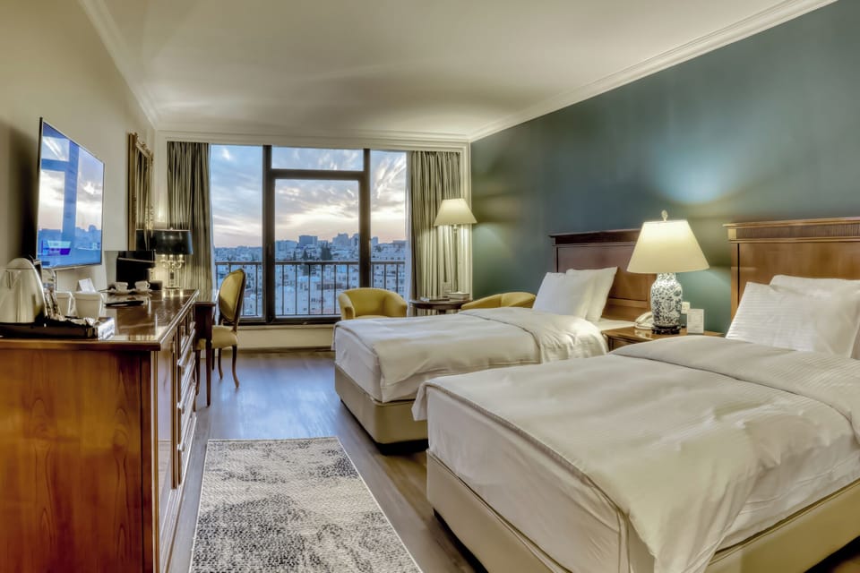 Deluxe Room | Minibar, in-room safe, soundproofing, iron/ironing board (on request)