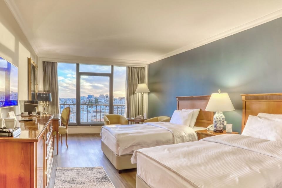 Deluxe Room | Minibar, in-room safe, soundproofing, iron/ironing board (on request)