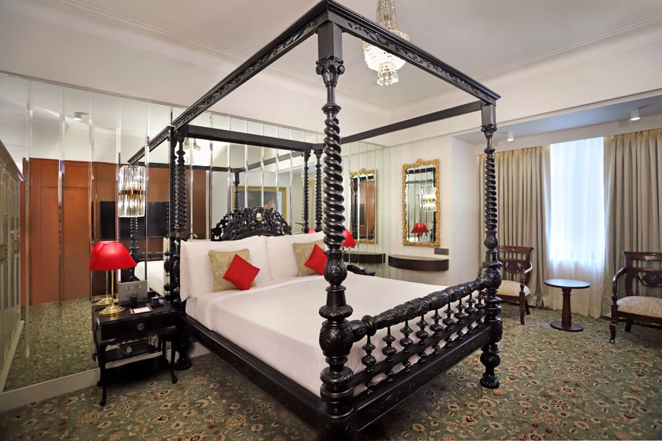 Luxury Suite | In-room safe, desk, blackout drapes, iron/ironing board