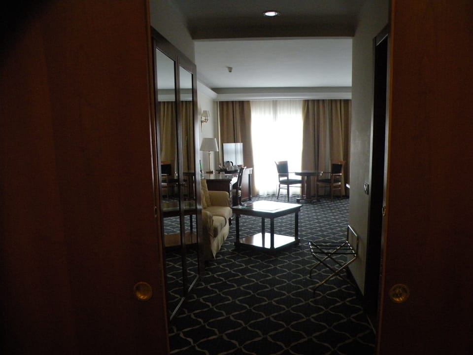 Family Studio Suite | Living area | 32-cm LCD TV with cable channels, TV