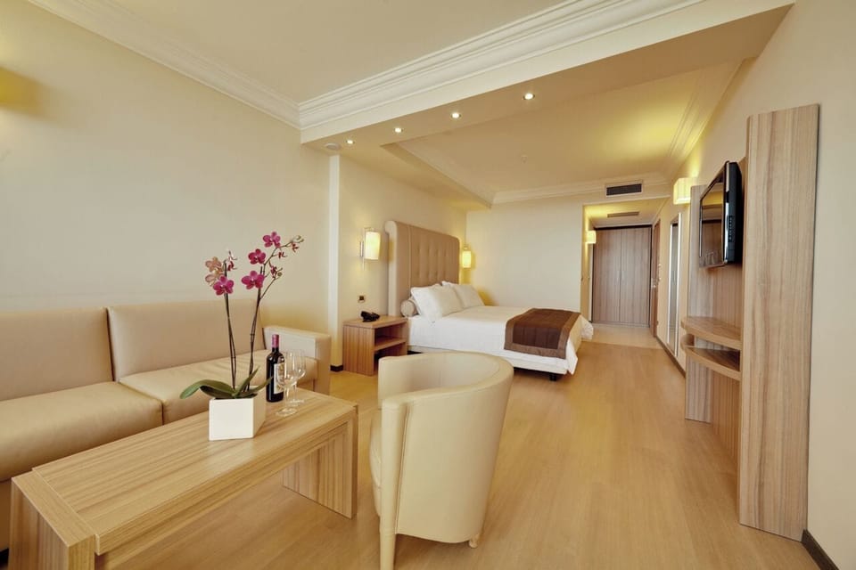 Room, Balcony, Sea View (Suite Festival) | Minibar, in-room safe, desk, soundproofing