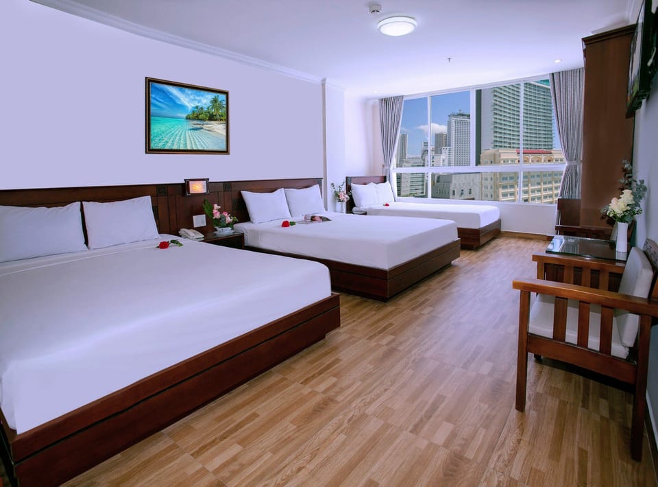 Deluxe Room, City View | Minibar, desk, blackout drapes, free WiFi