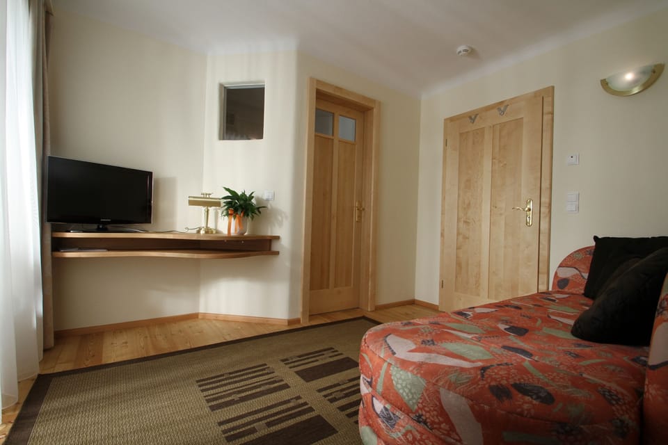 Junior Suite, Balcony | Living area | Flat-screen TV