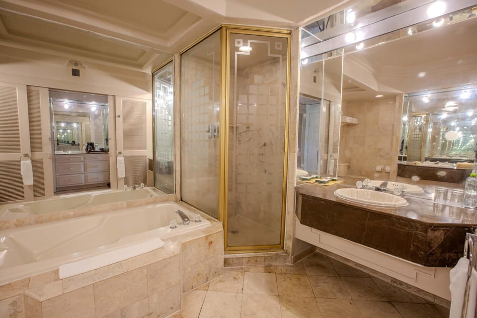 Separate tub and shower, rainfall showerhead, eco-friendly toiletries