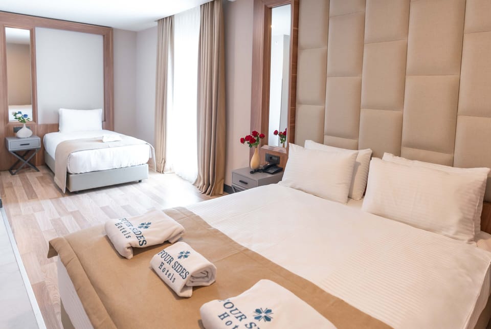 Deluxe Room, 1 Bedroom | Minibar, in-room safe, soundproofing, Internet