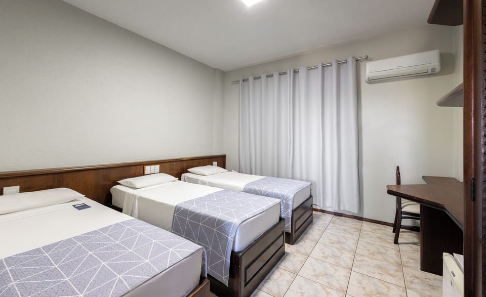 Superior Triple Room | Minibar, in-room safe, desk, WiFi