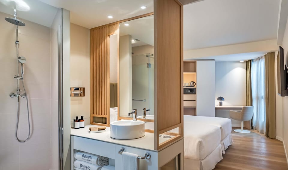Premium bedding, down comforters, minibar, in-room safe