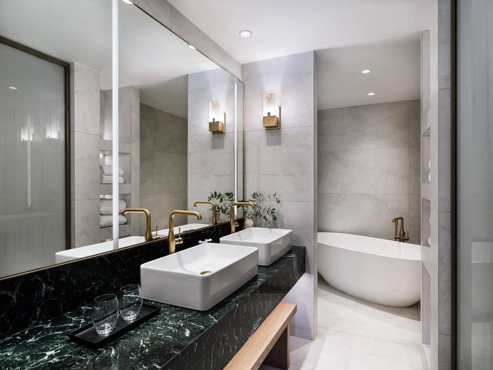 Presidential Suite | Bathroom | Designer toiletries, hair dryer, bathrobes, slippers