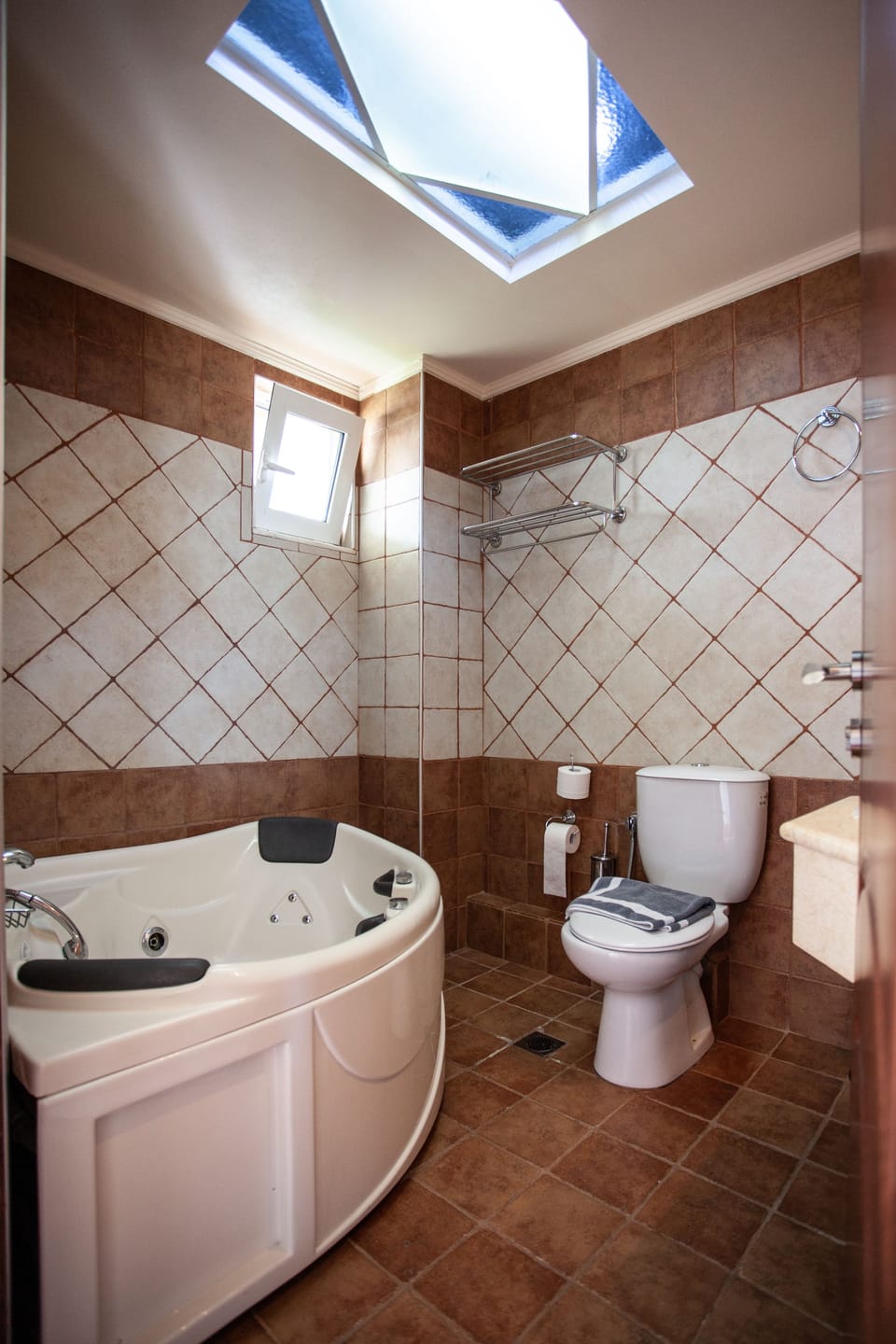 Shower, rainfall showerhead, hair dryer, towels