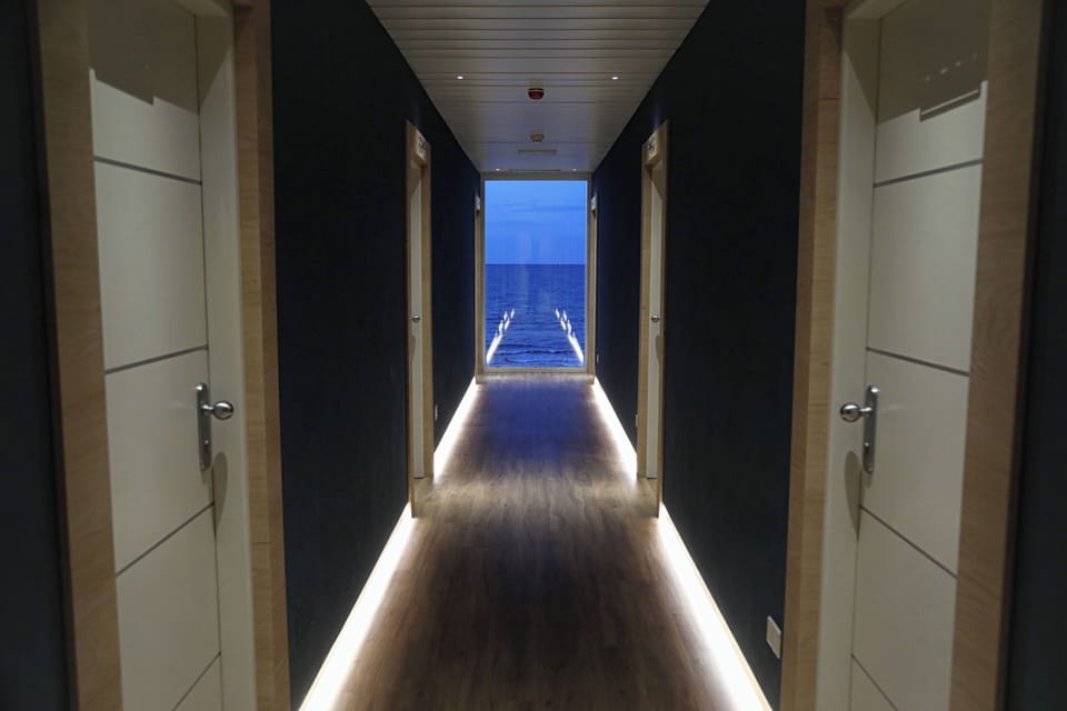 Economy Room, Balcony, Partial Sea View | Minibar, in-room safe, desk, laptop workspace
