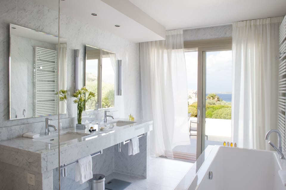 Designer toiletries, hair dryer, bathrobes, slippers
