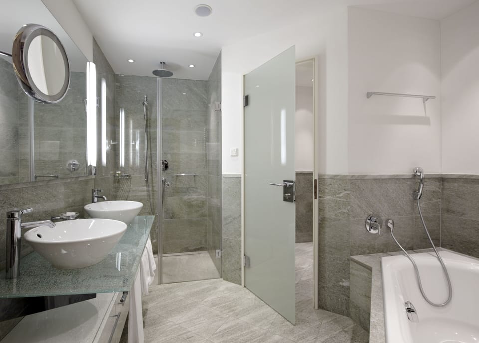 Suite | Bathroom | Hair dryer, bathrobes, slippers, towels