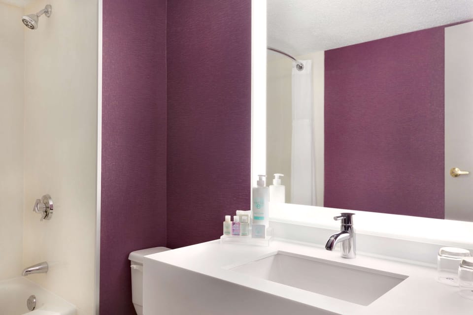Combined shower/tub, eco-friendly toiletries, hair dryer, slippers