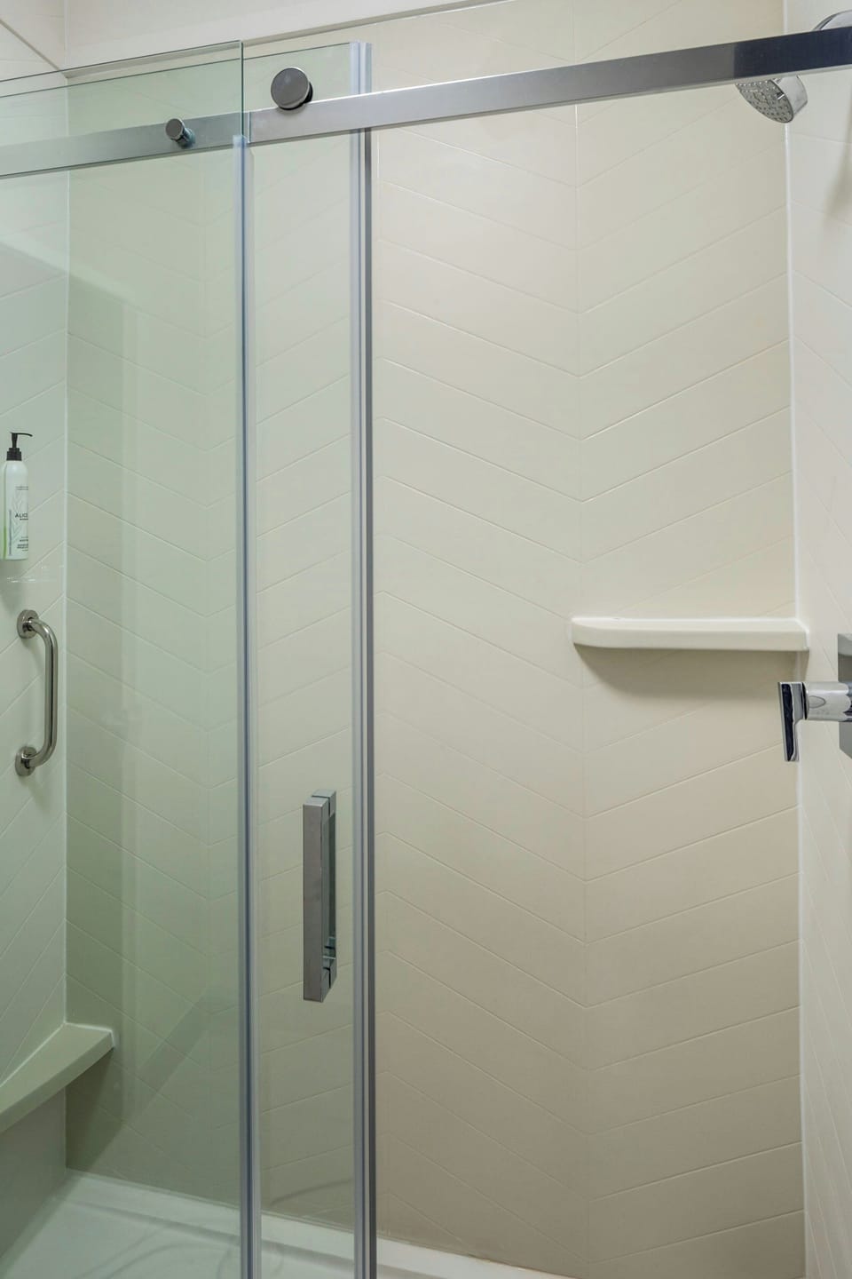 Shower, designer toiletries, hair dryer, towels