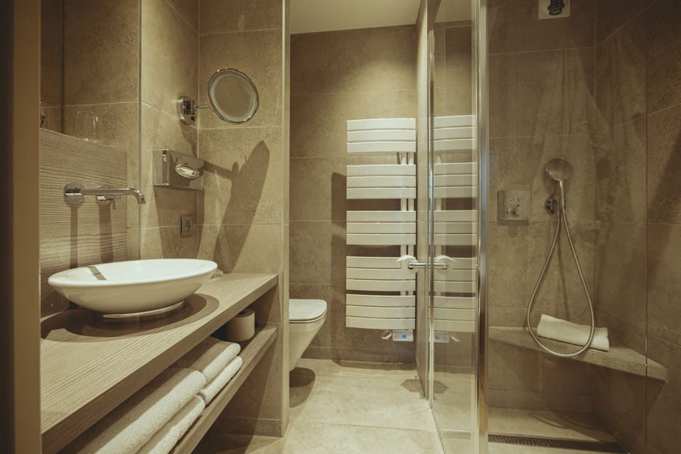 Prestige Double Room | Bathroom | Designer toiletries, hair dryer, towels