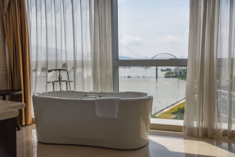Separate tub and shower, deep soaking tub, designer toiletries