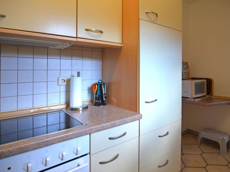 Apartment | Private kitchen | Stovetop, highchair