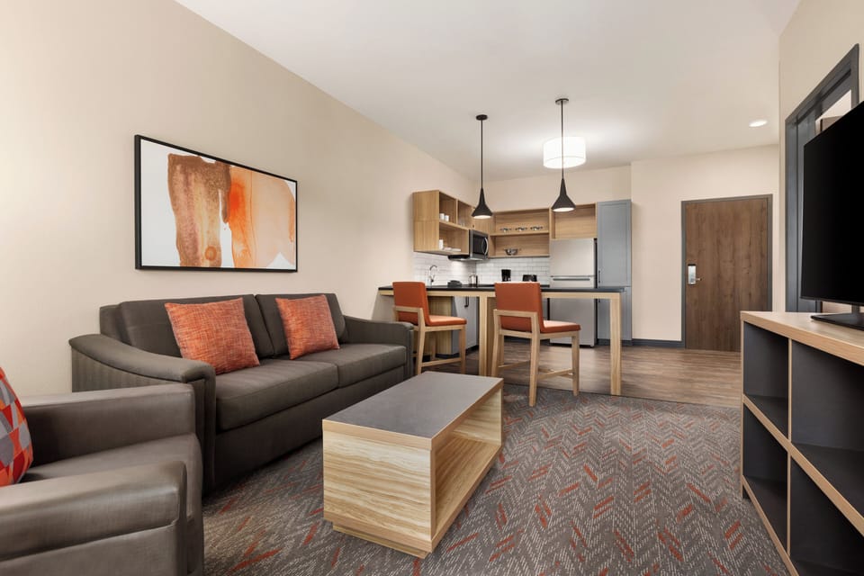 Premium bedding, desk, laptop workspace, blackout drapes