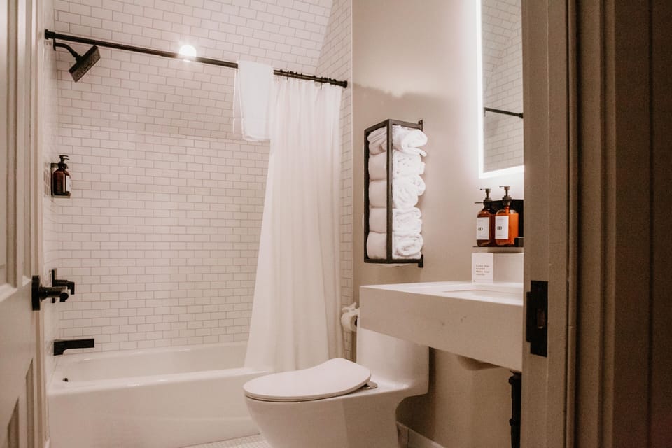 Suite, 1 Queen Bed with Sofa bed | Bathroom | Hair dryer, towels
