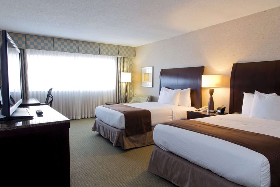 Room, 2 Queen Beds, Non Smoking | In-room safe, desk, blackout drapes, iron/ironing board