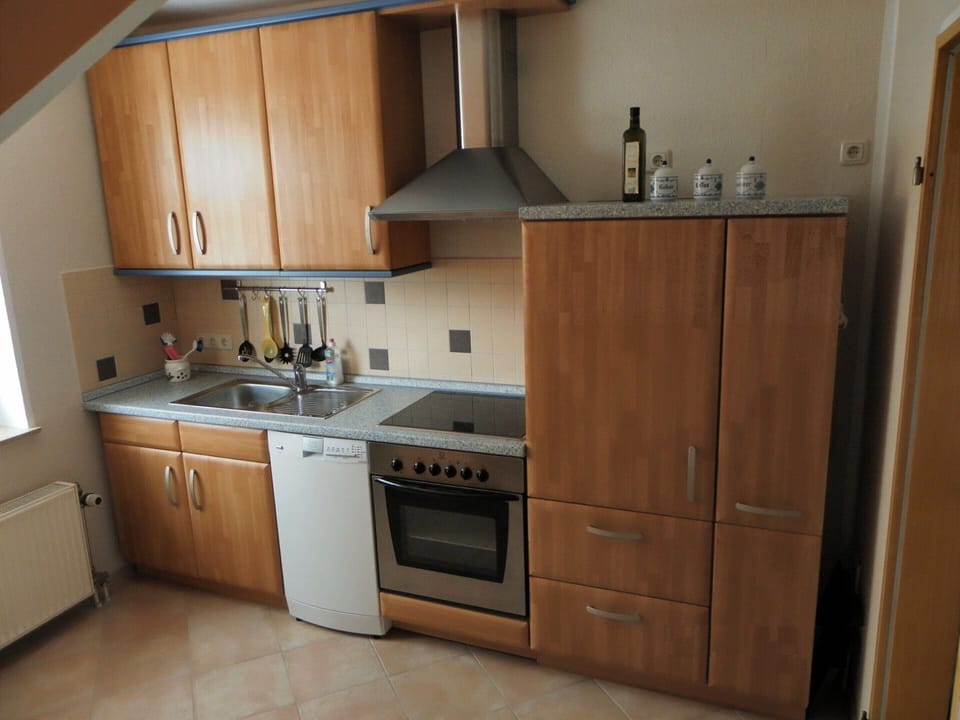 Apartment | Private kitchen | Stovetop, electric kettle, highchair
