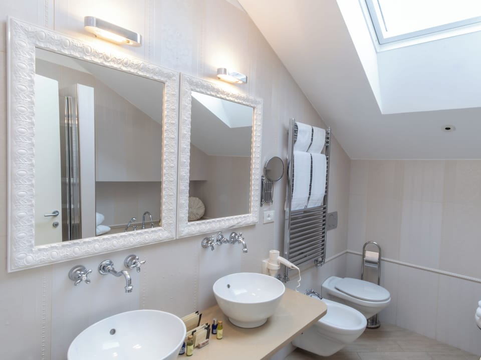 Suite, Hot Tub, Sea View | Bathroom | Rainfall showerhead, designer toiletries, hair dryer, slippers